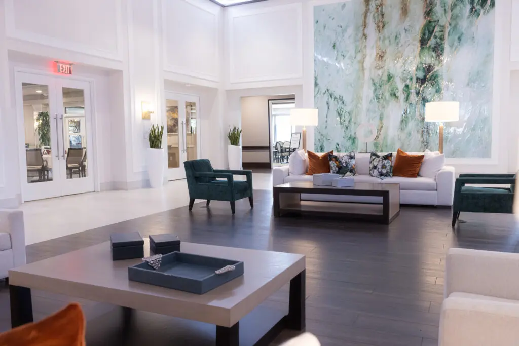 Elegant living room with Expert Tile & Flooring installation in South Florida, featuring modern decor and striking wall tiles.