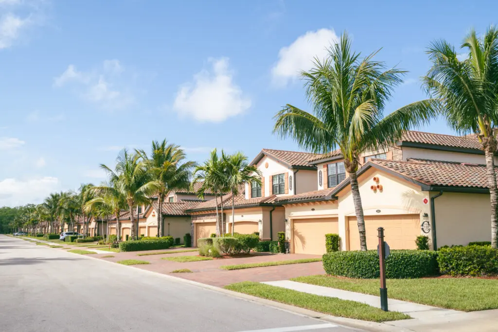 Street view of modern homes in Florida with expert tile roofing, ideal for Expert Tile & Flooring installation services.