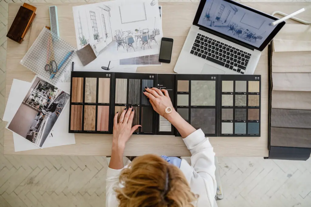 Expert Tile & Flooring Tile Installation in South Florida, showcasing a selection of diverse tile samples on a desk.