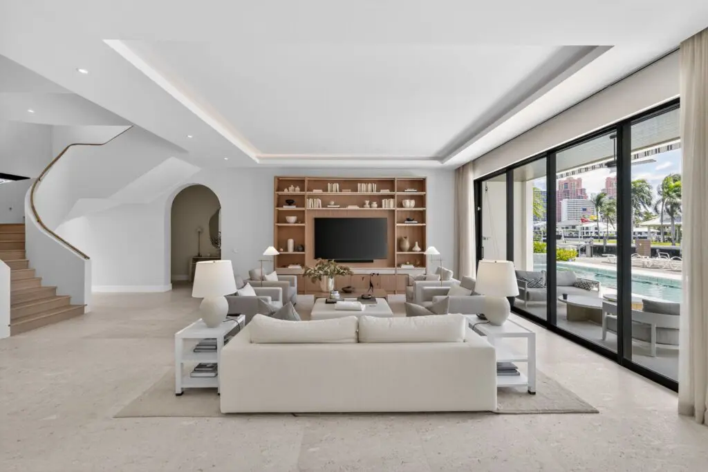 Modern living room with elegant tile flooring by Expert Tile & Flooring, Cooper City, Florida. Bright, spacious design.