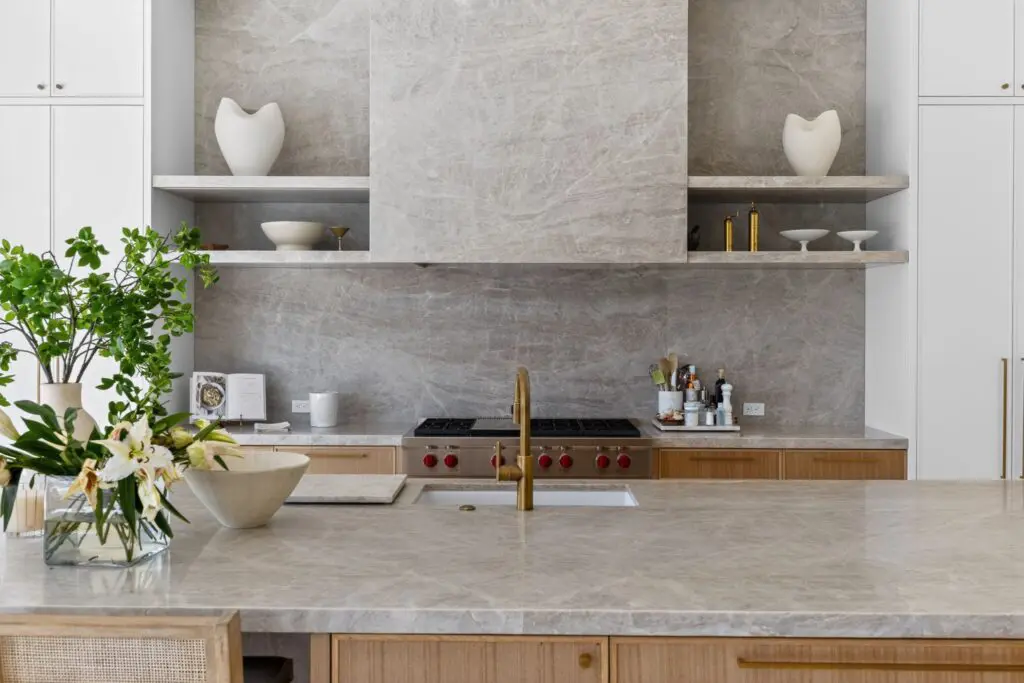 Modern kitchen with gray marble countertops and backsplash by Expert Tile & Flooring Tile Installation in South Florida.