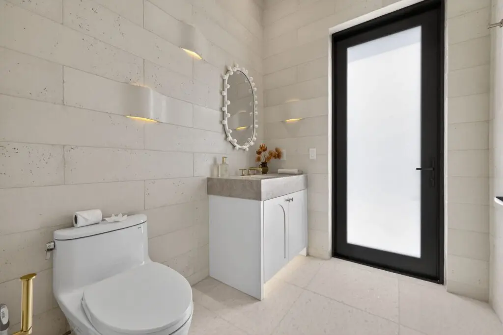 Modern bathroom with elegant tile flooring and walls by Expert Tile & Flooring Tile Installation, Cooper City, Florida.
