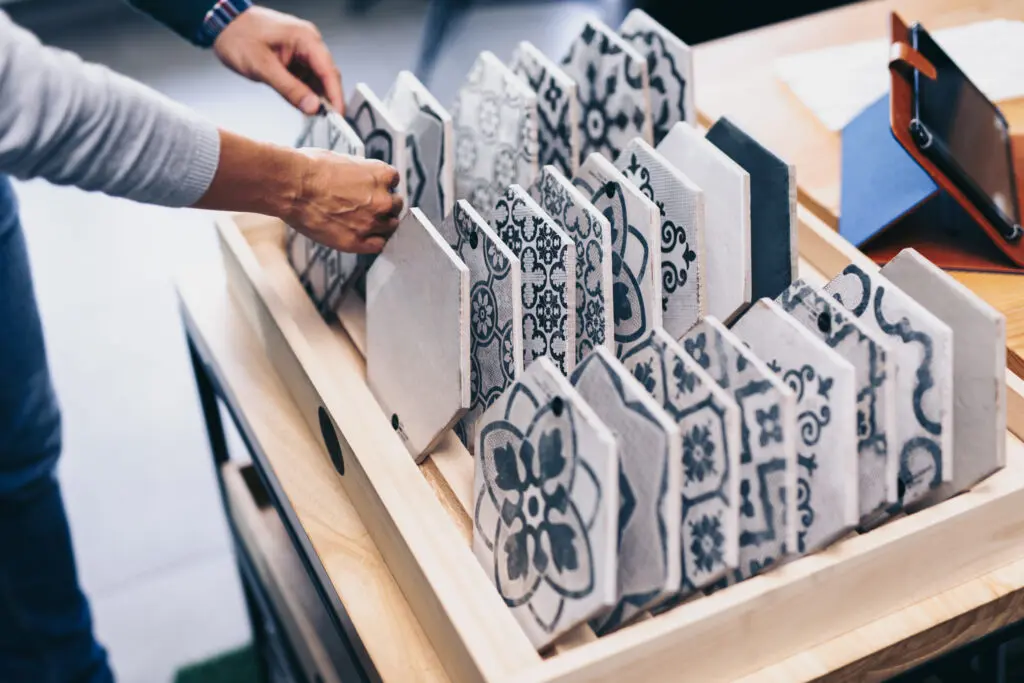 Middle age couple choosing new ceramic tiles for their home.