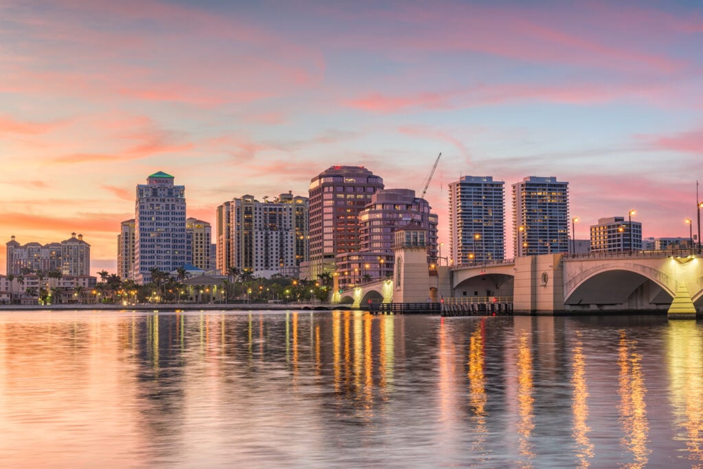 Sunset view of a bridge and skyline in Florida, highlighting Expert Tile & Flooring Tile Installation services.