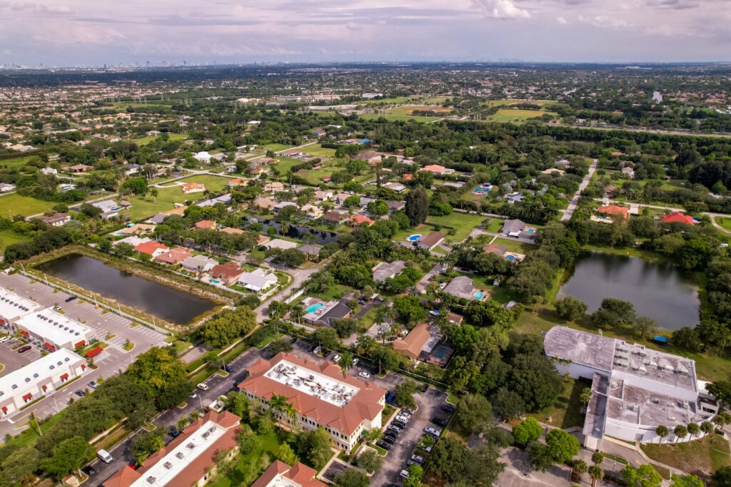 Aerial view of Florida, showcasing residential areas and greenery, ideal for Expert Tile & Flooring installations.